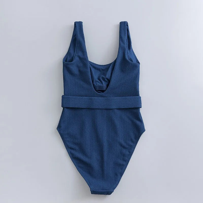 Navy blue women's one-piece swimsuit with slimming triangle design and chest pad for swimming