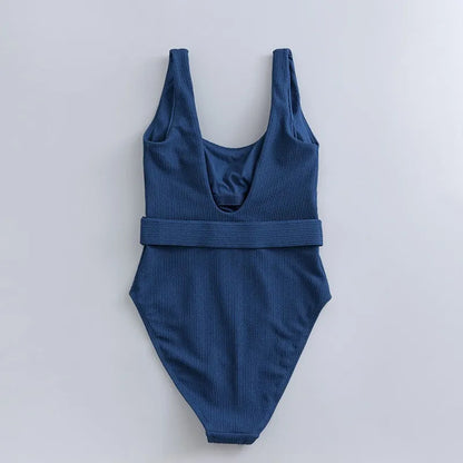 Navy blue women's one-piece swimsuit with slimming triangle design and chest pad for swimming