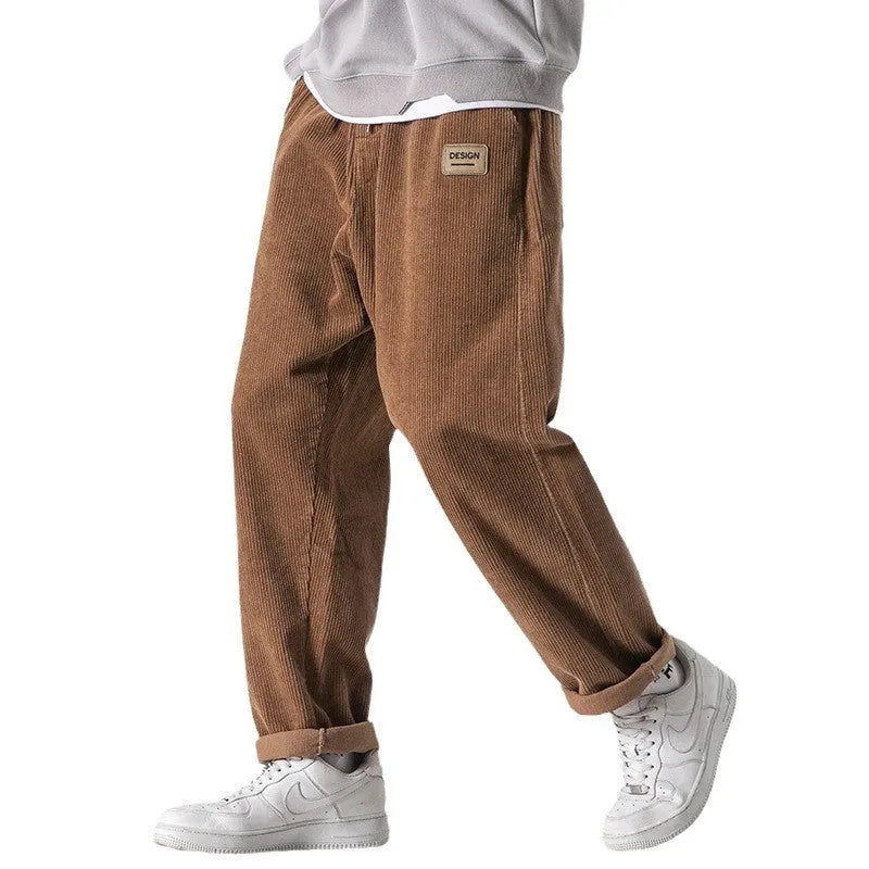 Men's loose fit corduroy sports trousers in Army Green colour with straight leg design and elasticated waist