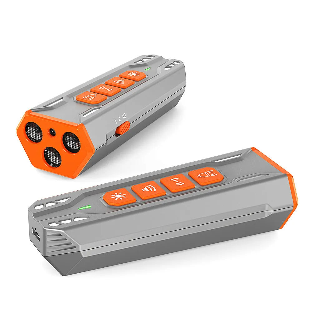 Handheld grey and orange ultrasonic dog trainer with three heads and a remote control.