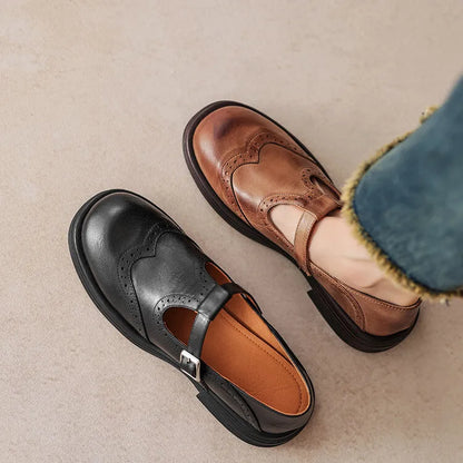 Women's black and brown round-toe flat casual shoes made from sheepskin leather.