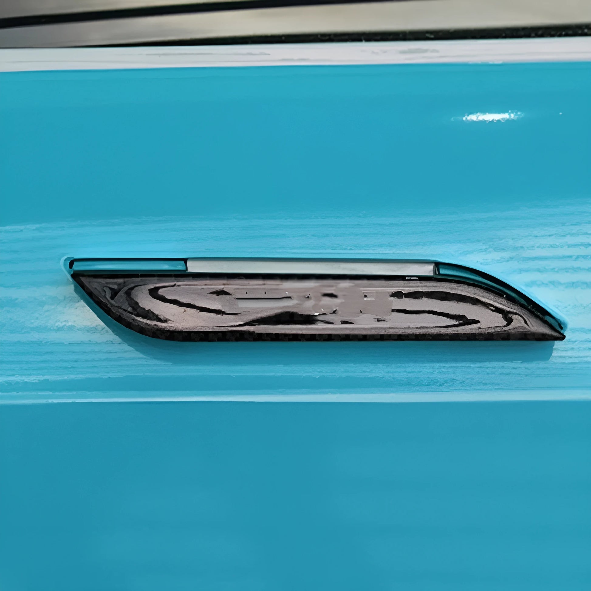 Set of four carbon fibre texture adhesive door handle protectors for Tesla Model S interior.