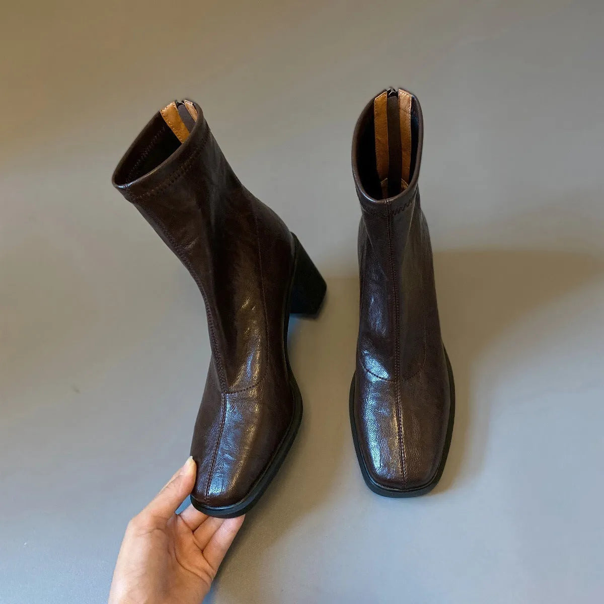 Women's retro ankle boots with chunky mid heel, square toe, back zipper, black microfibre upper, rubber sole.