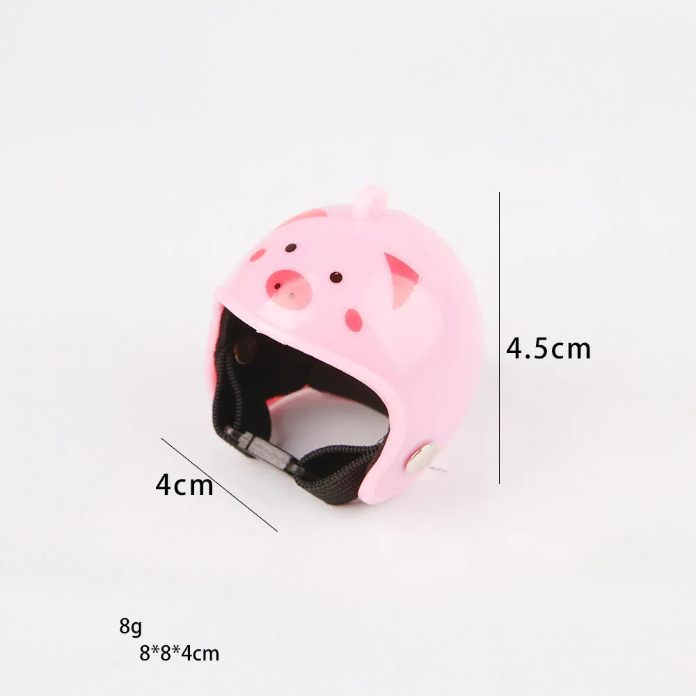 Small hard plastic helmet with elastic straps and sponge lining, designed for a chicken or bird to wear.