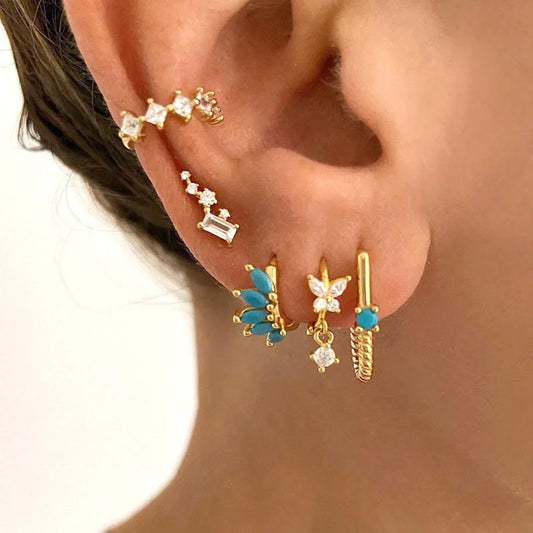 Stylish symmetrical horse eye stone earrings in various colours, perfect for any occasion.