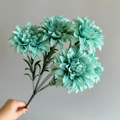 Desktop fan-shaped display holding artificial silk flowers in rose and peony varieties with colourful petals