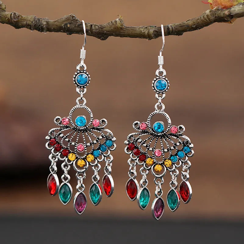 Purple drop-shaped alloy earrings with long fringe and crystal details on a retro style.