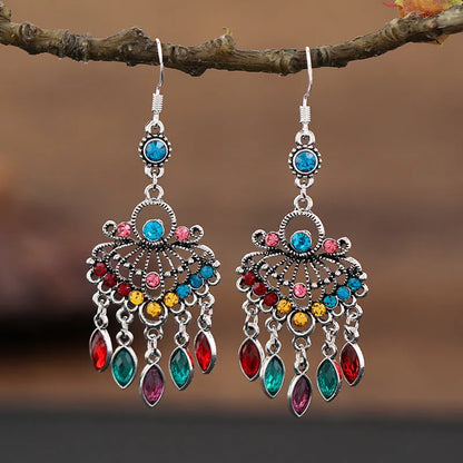 Purple drop-shaped alloy earrings with long fringe and crystal details on a retro style.
