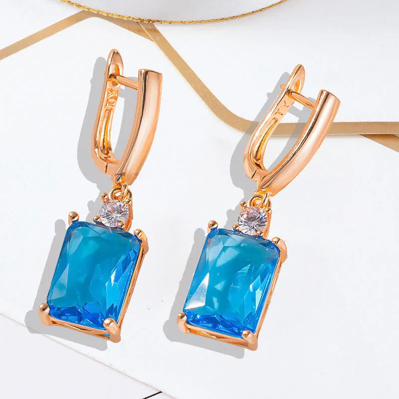 Square geometric earrings with gold electroplated finish on copper base
