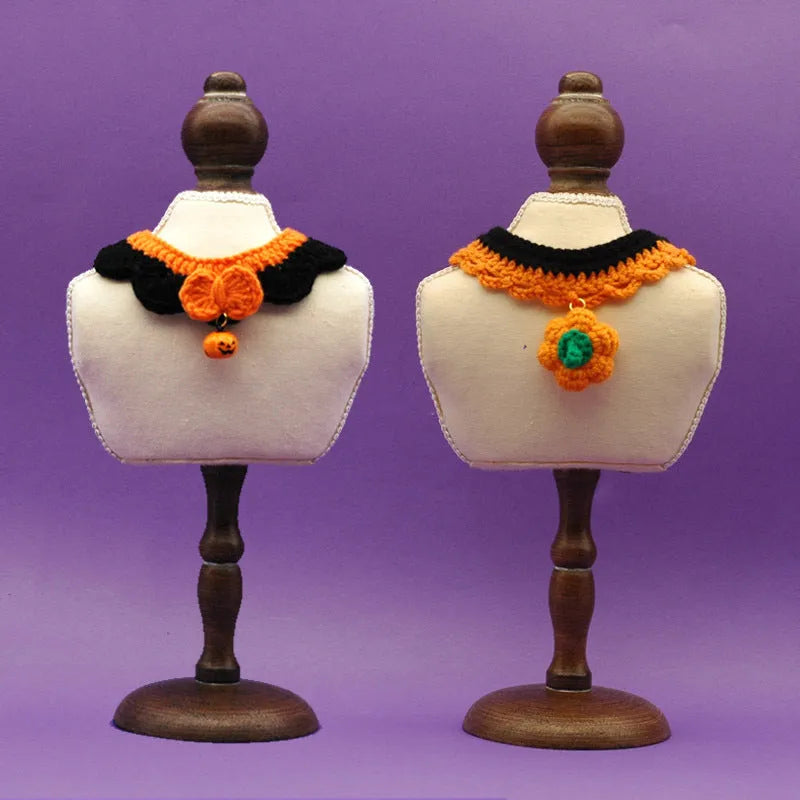 Hand-crocheted wool pet collar in pumpkin colour for a dog or cat, showing adjustable size and textured yarn.