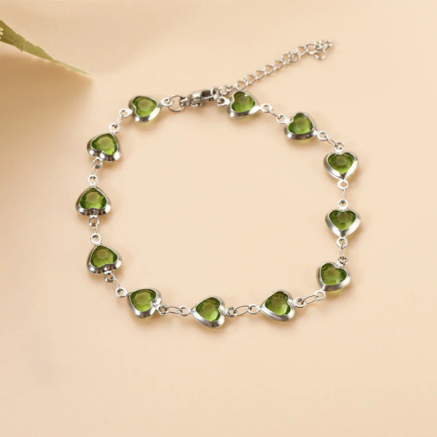 Devil's eye geometric heart bracelet in stainless steel showing colourful electroplated finish options.