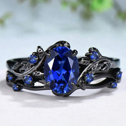 Geometric black women's couple ring with navy blue rhinestone inlay showing side profile