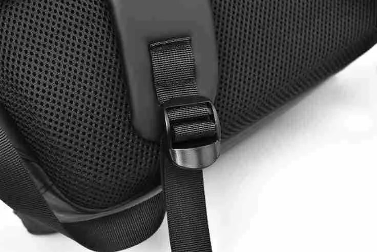 Large black waterproof PU leather laptop backpack with sewing thread details on a simple design.