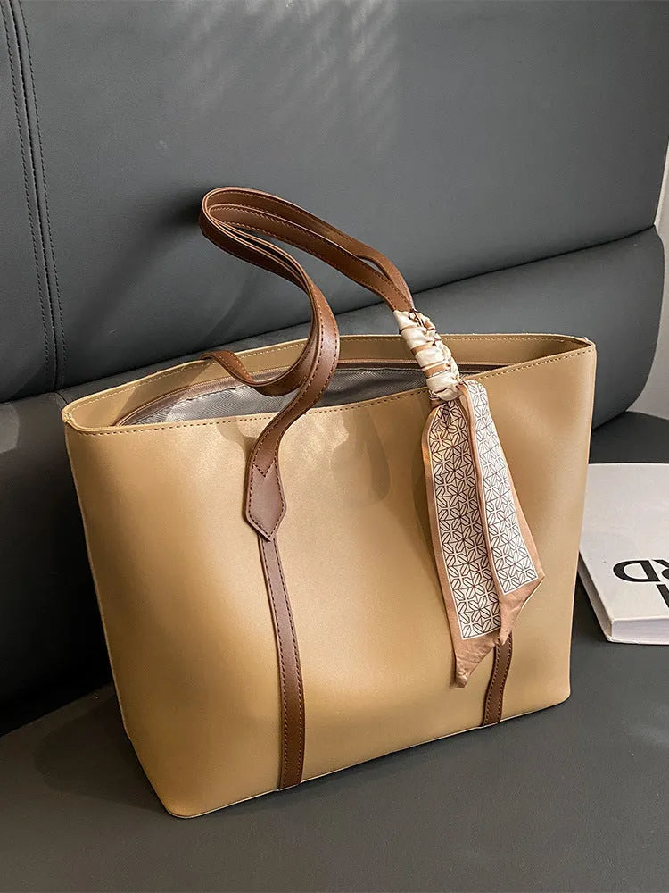 Women's large capacity casual tote crossbody shoulder bag in khaki colour with outer pocket and zip compartment.