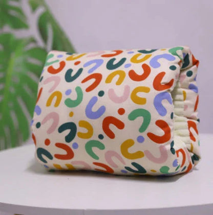Adjustable nursing pillow with various color options, designed to provide comfort and support for breastfeeding mothers