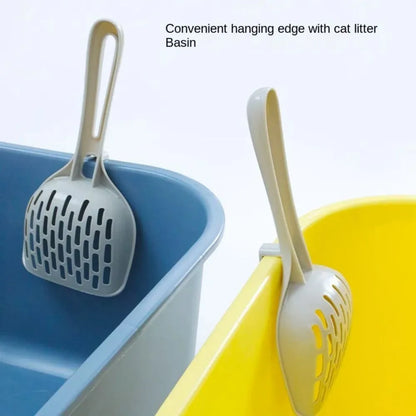Grey plastic cat litter scoop and self-cleaning base set for litter box maintenance.