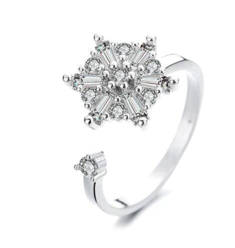 Adjustable spinner ring with rotating floral, geometric, and nature-inspired motifs for women's fashion and stress relief