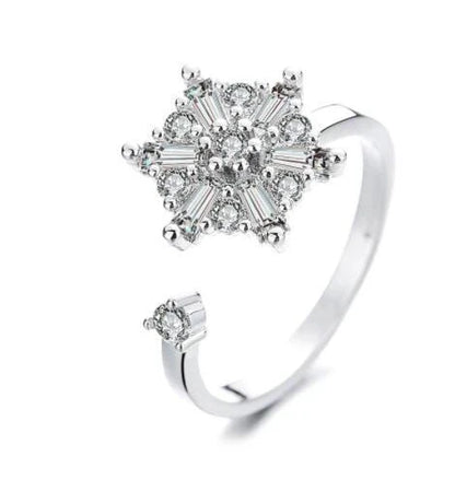 Adjustable spinner ring with rotating floral, geometric, and nature-inspired motifs for women's fashion and stress relief