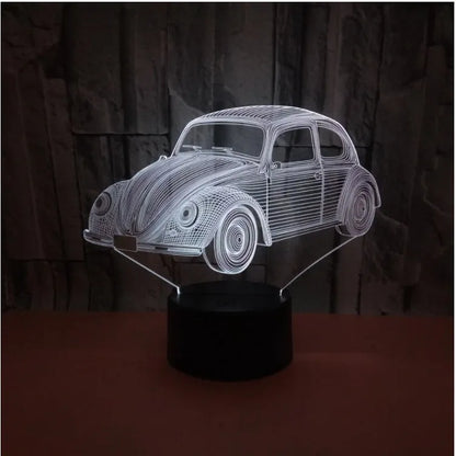 Colourful 3D LED table lamp with remote control and USB cable on wooden desk