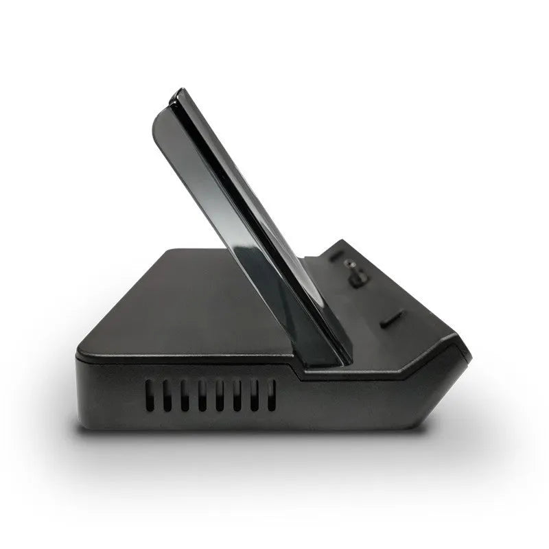GPD WIN4 handheld game console sitting in a black docking base expander showing multiple ports on the front.
