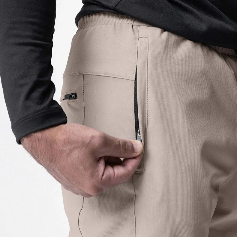 Men's grey fitness trousers with ankle ties, made from 100% polyester for quick-drying during exercise