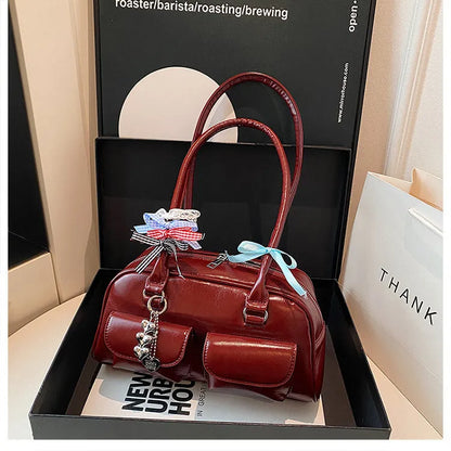 Women's retro pillow-shaped handbag in PU leather with double shoulder straps and flap closure