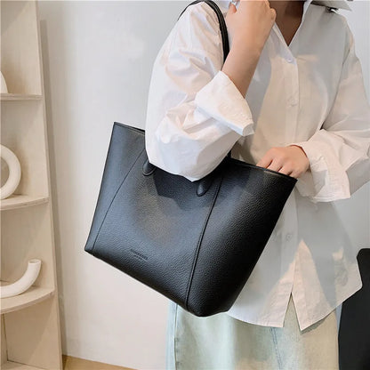 PU leather soft bucket shoulder tote bag with synthetic leather lining, outer sandwich pocket and zipper change bag