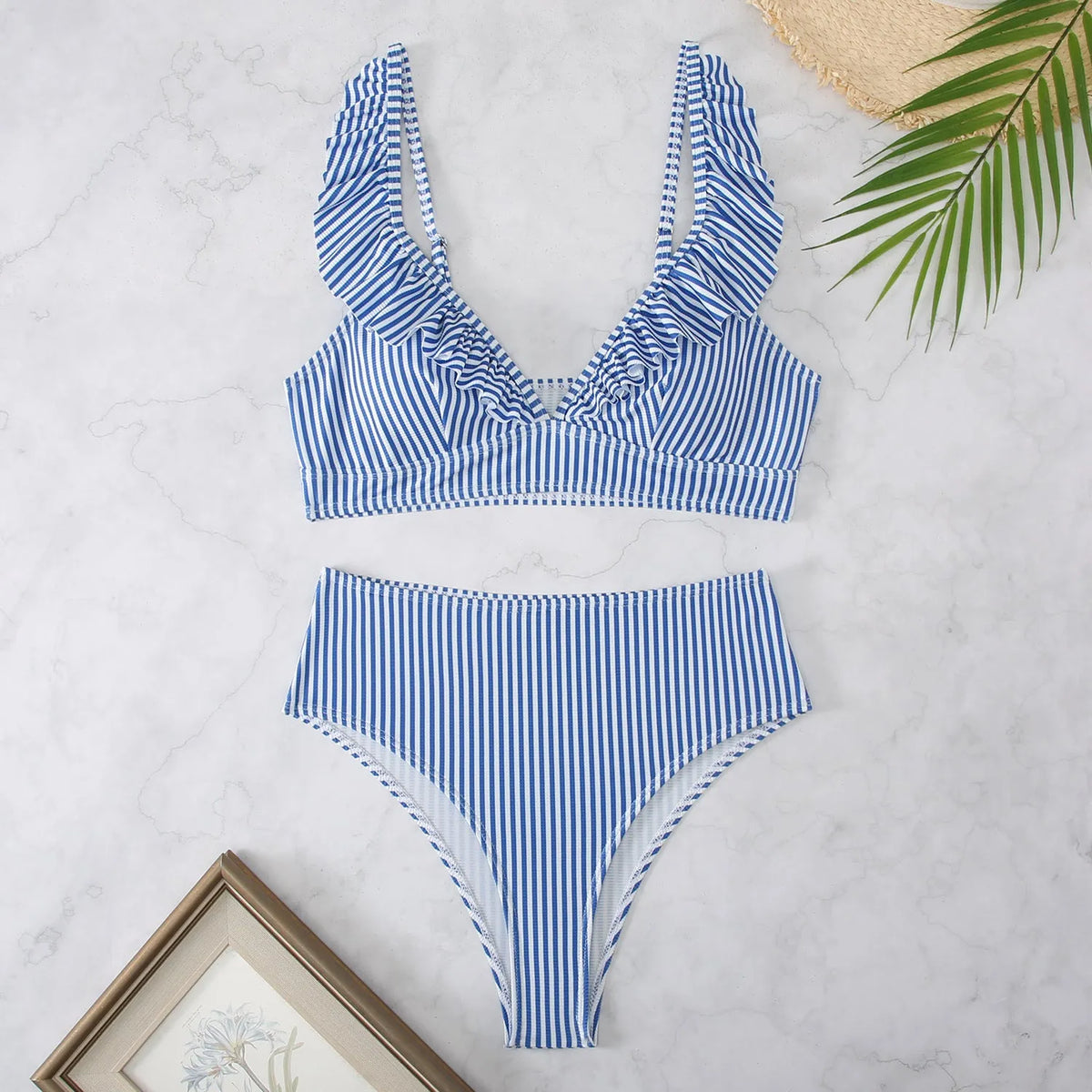 Women's retro striped split chest bikini swimsuit on a hanger