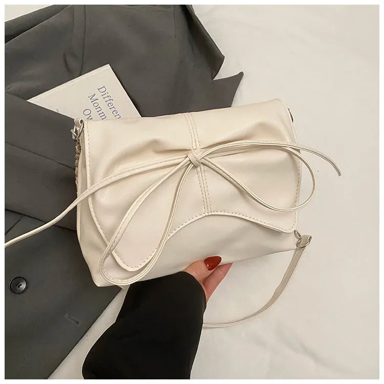 Black horizontal square PU crossbody bag showing internal mobile phone pocket and crossbody strap