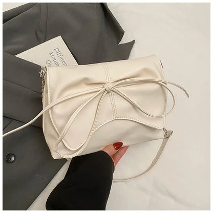Black horizontal square PU crossbody bag showing internal mobile phone pocket and crossbody strap