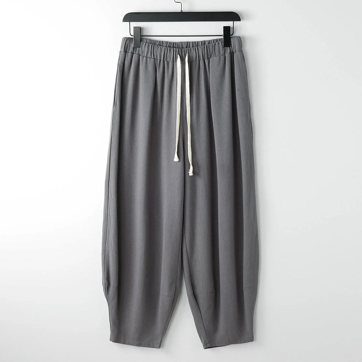 Loose linen harem pants with ankle ties in neutral colours for plus sizes
