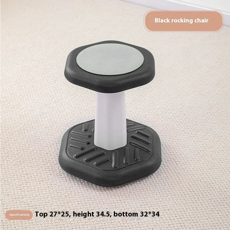 Balance children's plastic rocking stool in blue colour on a wooden floor.