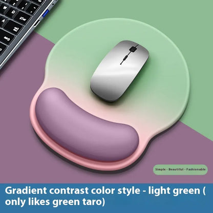 Silicone mouse mat with integrated wrist rest in a gradient blue black colour on a desk.