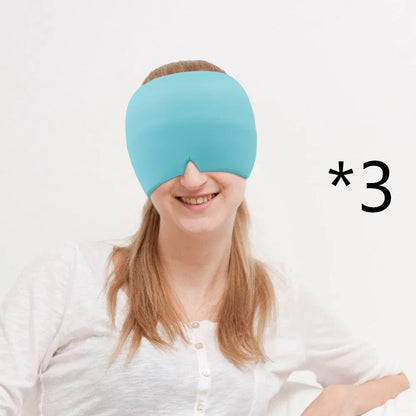Black elastic cloth gel cold compress eye mask for headache relief on a grey background.