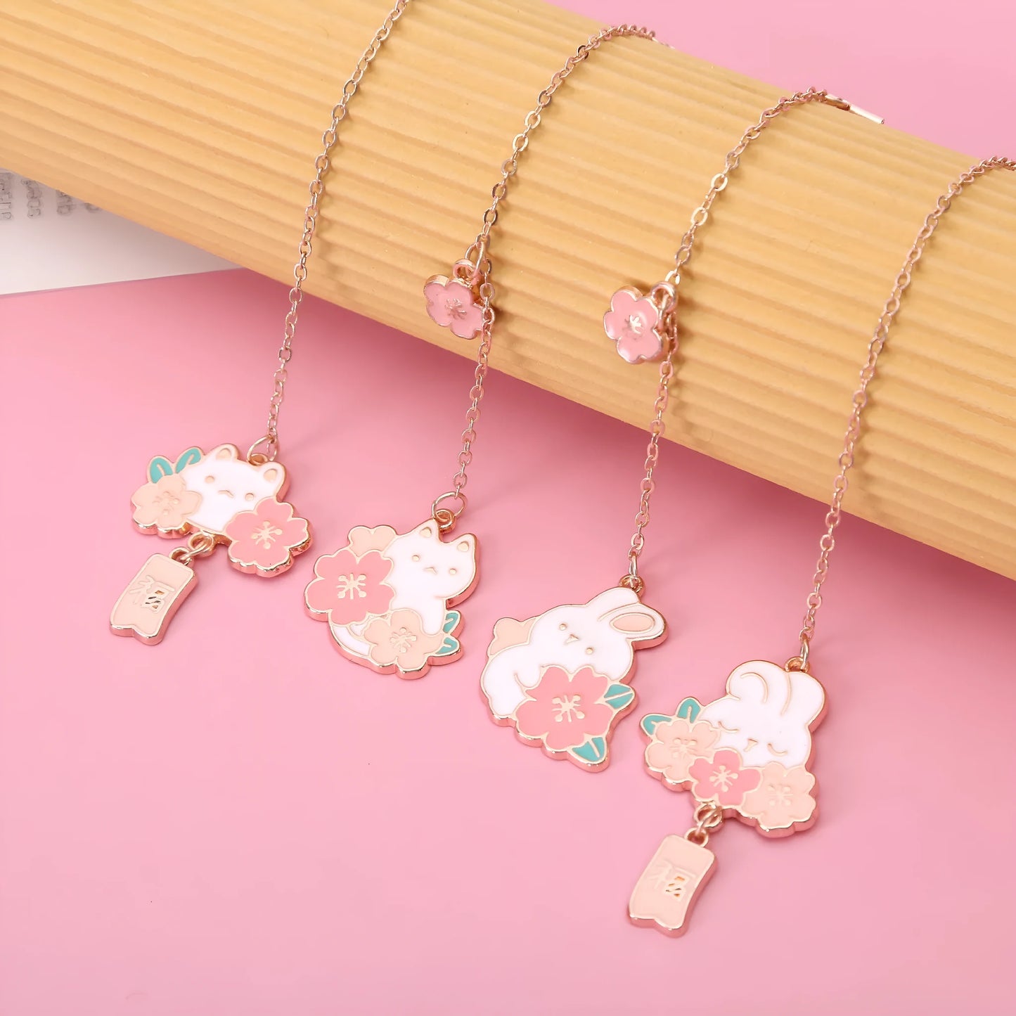 Metal bookmark holder with cartoon cherry blossom cat and rabbit designs