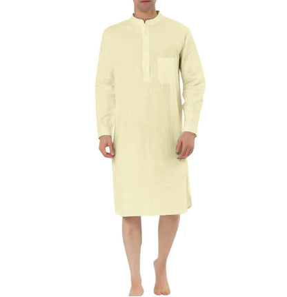 Man wearing a dark blue cotton shirt robe with button front, long sleeves, and side pockets.