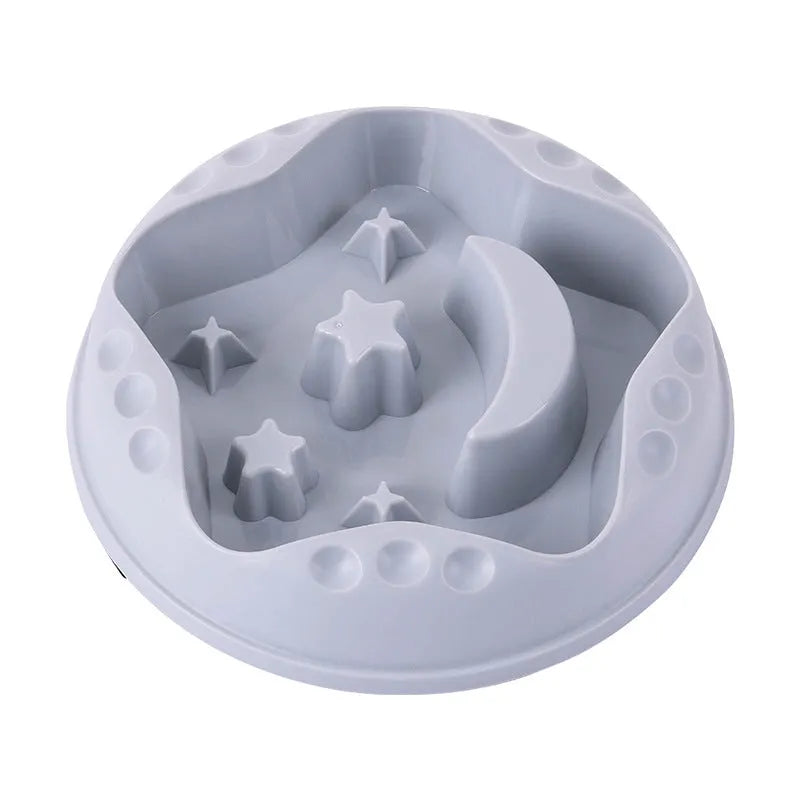 Blue slow feeder dog bowl with raised moon and star patterns inside, non-slip base