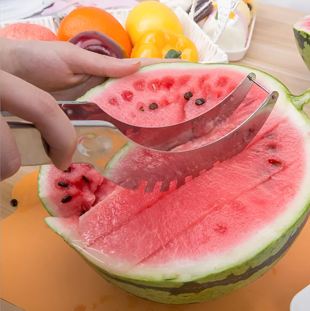 Silver stainless steel melon cutter for slicing watermelon and other large fruits.