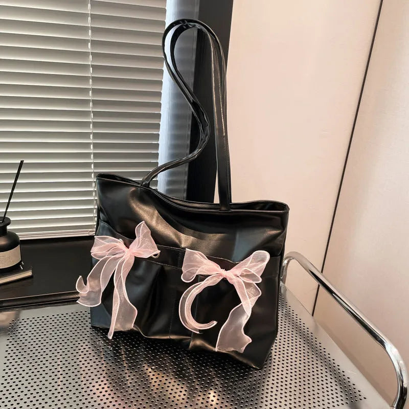 College style bow tote bag in black PU leather with double shoulder straps and bow detailing
