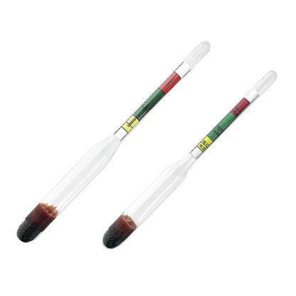 A red and black glass electrohydraulic hydrometer for testing car battery electrolyte density.