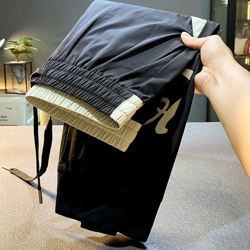 Men's trousers cropped ankle banded ice silk cotton casual solid black trousers in slim fit ultra-thin fabric for warm weather, available in Asian sizing 28 to 38 with detailed weight guidance for accurate selection.