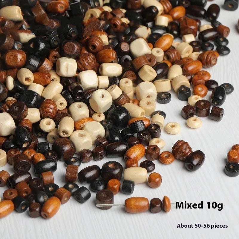 Mixed colour vintage solid wood beads scattered for DIY jewellery making and ethnic style craft projects