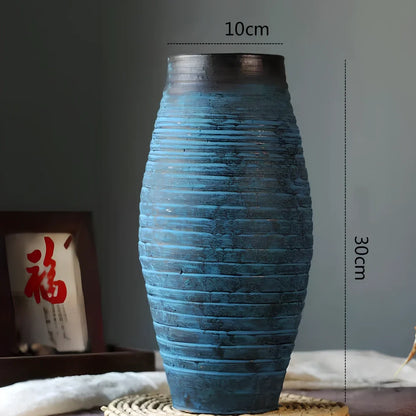 Ceramic mosaic vase with dried flower arrangement, handcrafted surface detailing