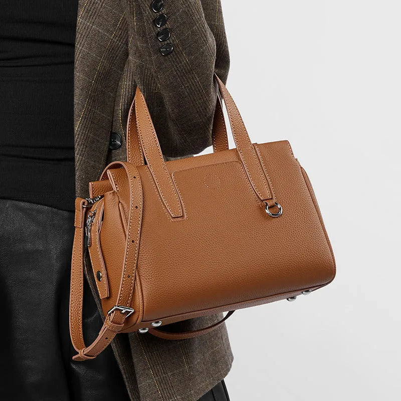 Genuine cowhide leather crossbody bag in a horizontal square shape with a single strap.