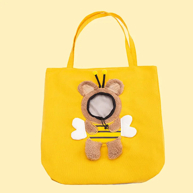 Little Bee Design blue canvas pet carrier bag with animal pattern, showing adjustable side opening for a pet's head.