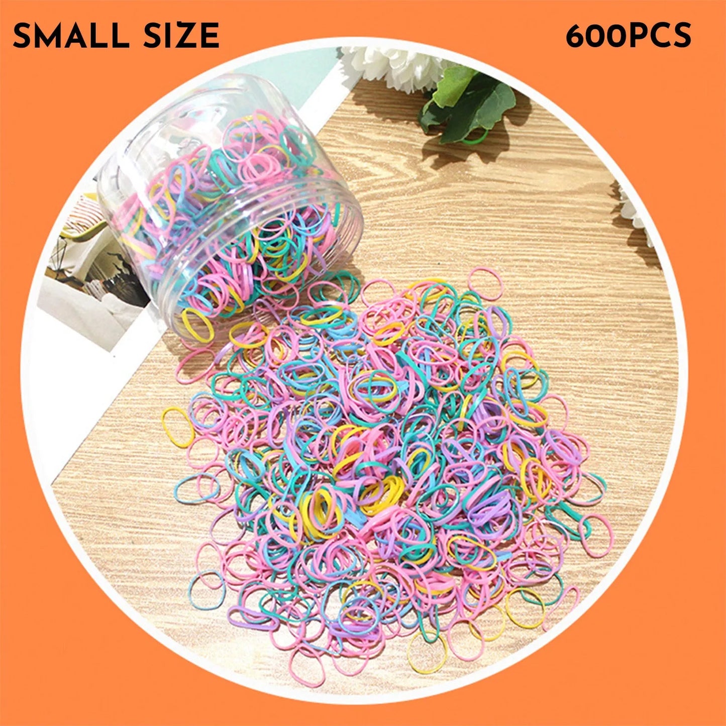 Assorted colourful thin TPU baby hair ties for toddlers and kids in a reusable plastic storage container.