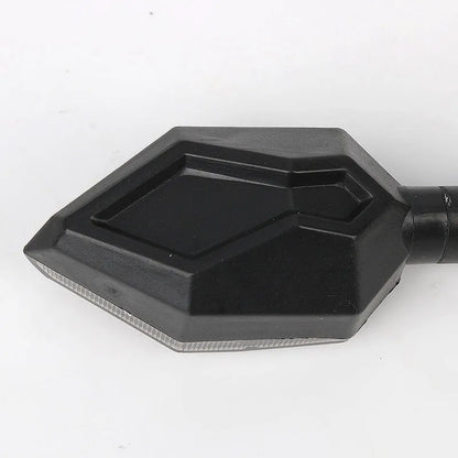 Arrow-shaped LED motorcycle directional turn signal light for 12V systems.