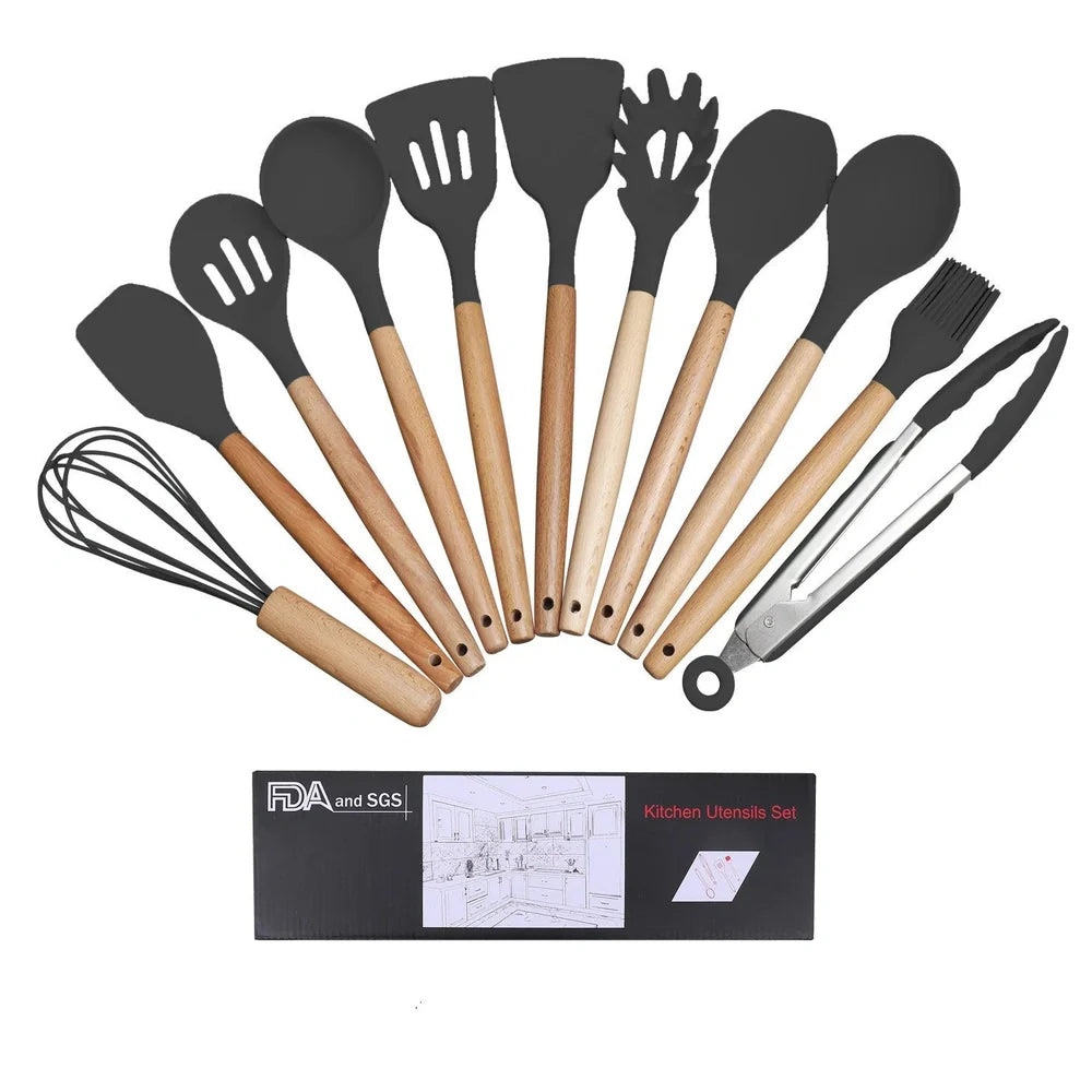 Dark grey silicone cooking utensils with wooden handles including spatula, spoon, whisk, and tongs
