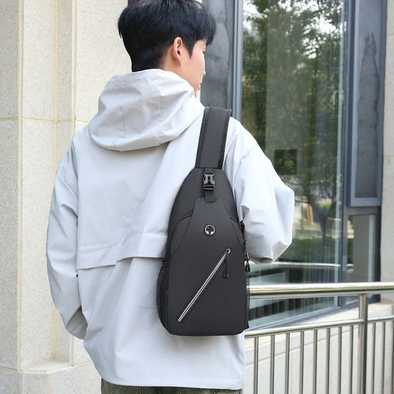 Rugged canvas crossbody bag for men in various colors, featuring a spacious main compartment, adjustable shoulder strap, and multiple pockets for organized storage.