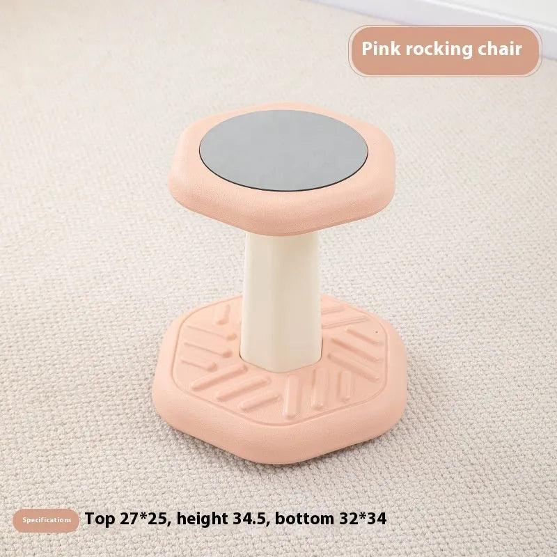 Balance children's plastic rocking stool in blue colour on a wooden floor.